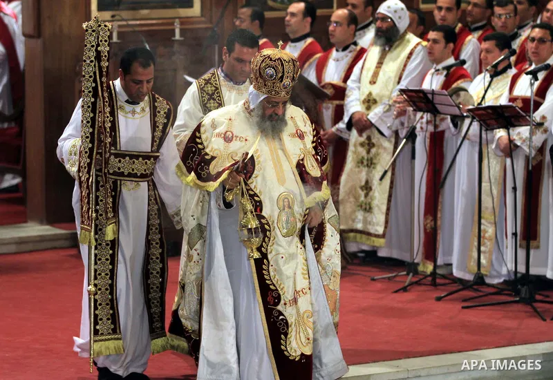 Coptic Pope Tawadros II, swings an incense burner during Christmas Eve Mass at Cairo s St. Mark s Cathedral, seat of the Coptic Orthodox Pope, in Cairo, Egypt, Monday Jan. 6, 2014. Millions of Egyptian Christians on Mond...