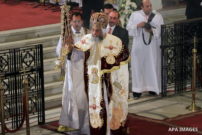 Coptic Pope Tawadros II, swings an incense burner during Christmas Eve Mass at Cairo s St. Mark s Cathedral, seat of the Coptic Orthodox Pope, in Cairo, Egypt, Monday Jan. 6, 2014. Millions of Egyptian Christians on Mond...