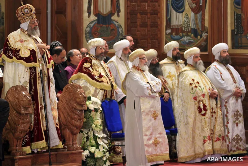Coptic Pope Tawadros II, swings an incense burner during Christmas Eve Mass at Cairo s St. Mark s Cathedral, seat of the Coptic Orthodox Pope, in Cairo, Egypt, Monday Jan. 6, 2014. Millions of Egyptian Christians on Mond...