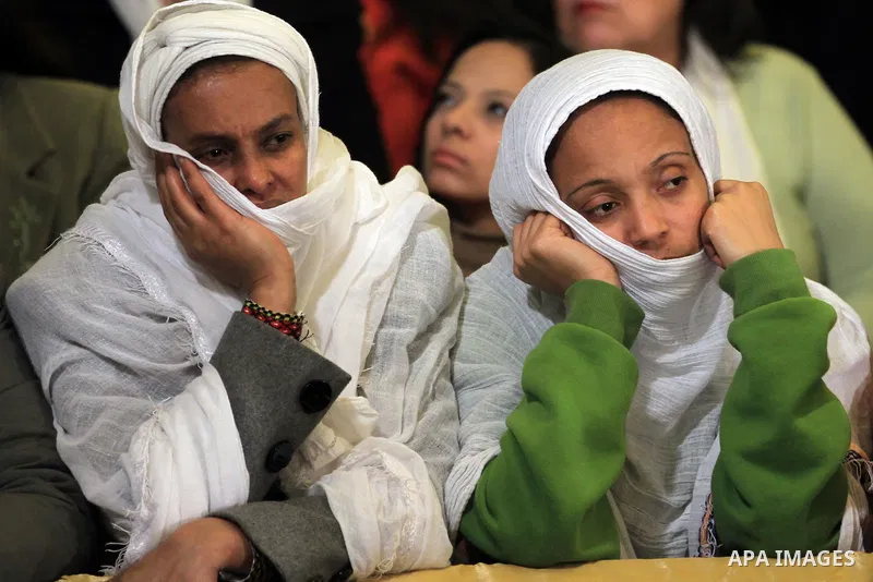Worshippers pray during Christmas Eve Mass at Cairo s St. Mark s Cathedral, seat of the Coptic Orthodox Pope, in Cairo, Egypt, late Monday Jan. 6, 2014. Millions of Egyptian Christians on Monday thronged to churches acro...