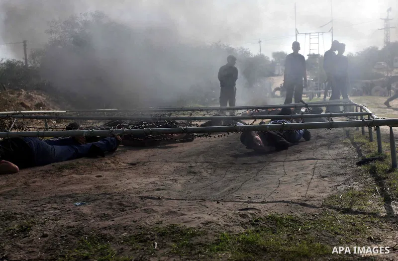 Palestinian high school students take part in a military-styled exercise routine at a course conducted by the Hamas-run ministry of education, in Rafah in the southern Gaza Strip January 9, 2014. Male students would lear...
