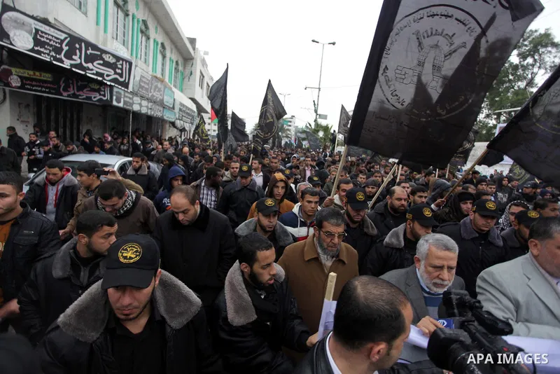 Palestinian supporters of the Islamic Jihad chant slogans against resuming peace talks with Israel as they demonstrate in Gaza City, Jan. 10, 2014. In recent weeks, U.S. Secretary of State John Kerry has stepped up invol...