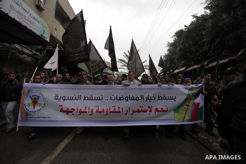 Palestinian supporters of the Islamic Jihad chant slogans against resuming peace talks with Israel as they demonstrate in Gaza City, Jan. 10, 2014. In recent weeks, U.S. Secretary of State John Kerry has stepped up invol...