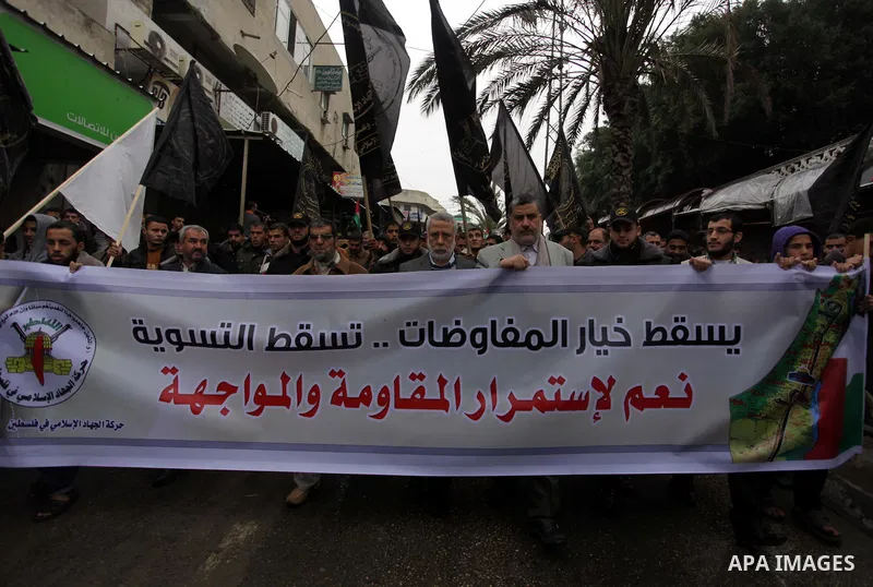 Palestinian supporters of the Islamic Jihad chant slogans against resuming peace talks with Israel as they demonstrate in Gaza City, Jan. 10, 2014. In recent weeks, U.S. Secretary of State John Kerry has stepped up invol...