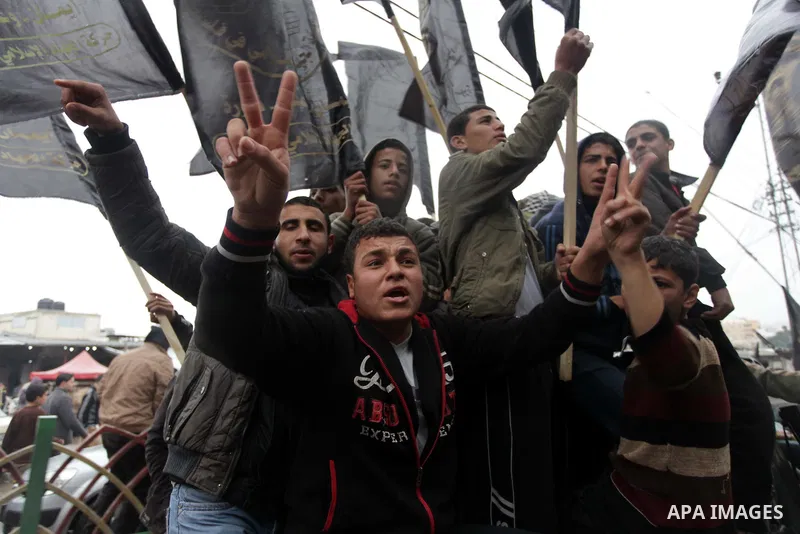 Palestinian supporters of the Islamic Jihad chant slogans against resuming peace talks with Israel as they demonstrate in Gaza City, Jan. 10, 2014. In recent weeks, U.S. Secretary of State John Kerry has stepped up invol...