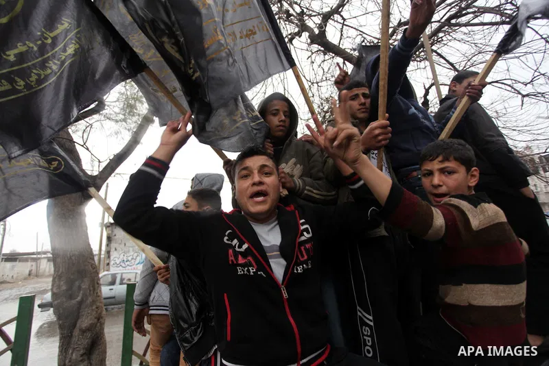 Palestinian supporters of the Islamic Jihad chant slogans against resuming peace talks with Israel as they demonstrate in Gaza City, Jan. 10, 2014. In recent weeks, U.S. Secretary of State John Kerry has stepped up invol...