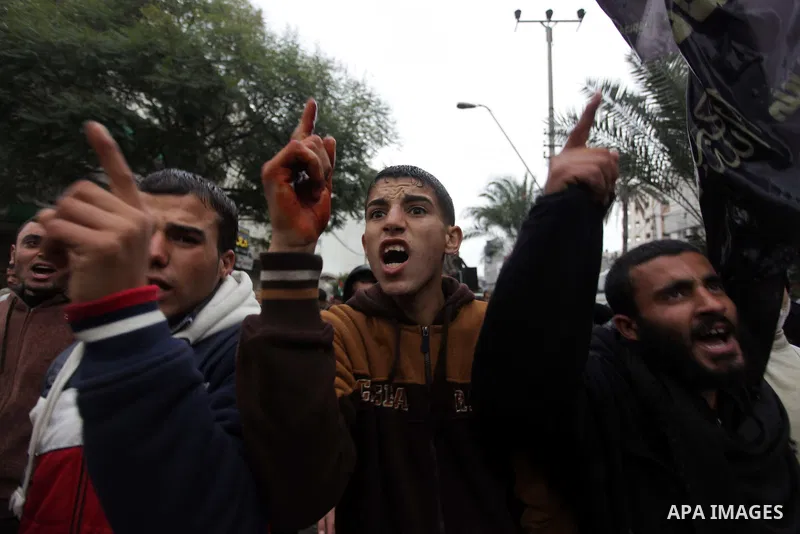Palestinian supporters of the Islamic Jihad chant slogans against resuming peace talks with Israel as they demonstrate in Gaza City, Jan. 10, 2014. In recent weeks, U.S. Secretary of State John Kerry has stepped up invol...