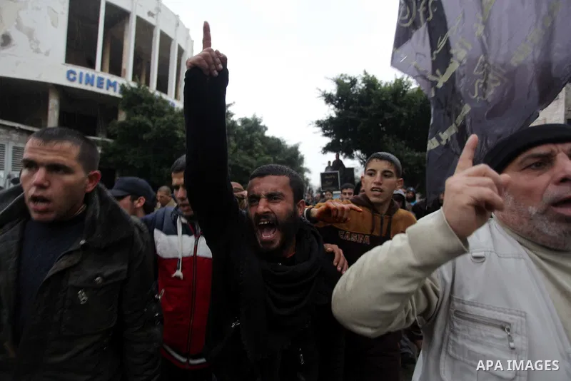Palestinian supporters of the Islamic Jihad chant slogans against resuming peace talks with Israel as they demonstrate in Gaza City, Jan. 10, 2014. In recent weeks, U.S. Secretary of State John Kerry has stepped up invol...