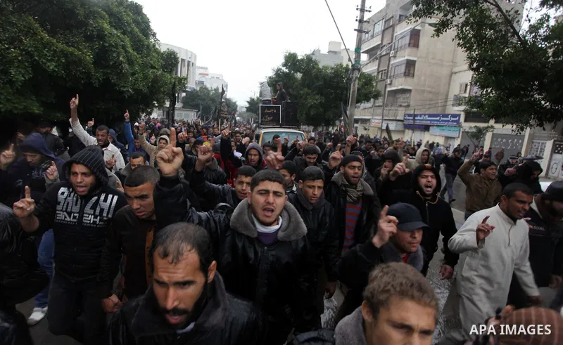 Palestinian supporters of the Islamic Jihad chant slogans against resuming peace talks with Israel as they demonstrate in Gaza City, Jan. 10, 2014. In recent weeks, U.S. Secretary of State John Kerry has stepped up invol...