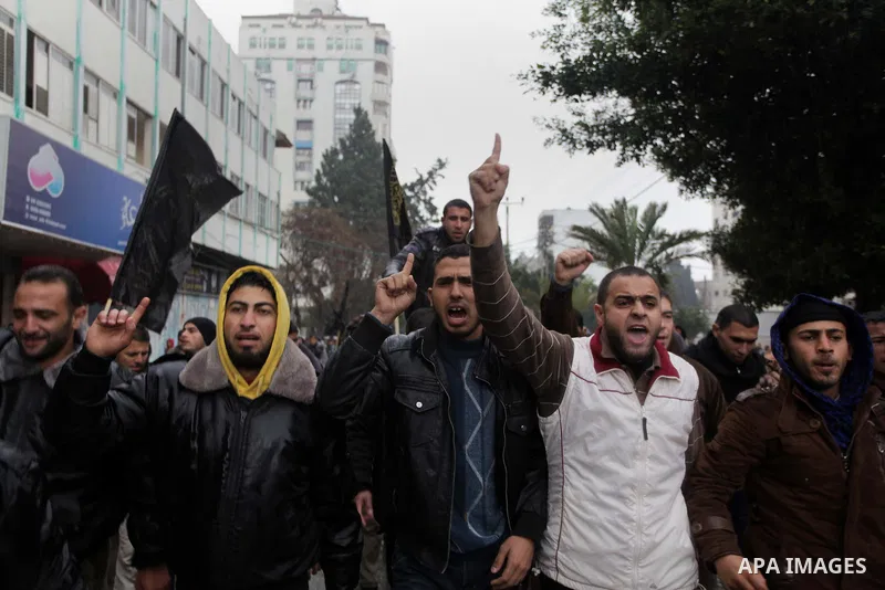 Palestinian supporters of the Islamic Jihad chant slogans against resuming peace talks with Israel as they demonstrate in Gaza City, Jan. 10, 2014. In recent weeks, U.S. Secretary of State John Kerry has stepped up invol...