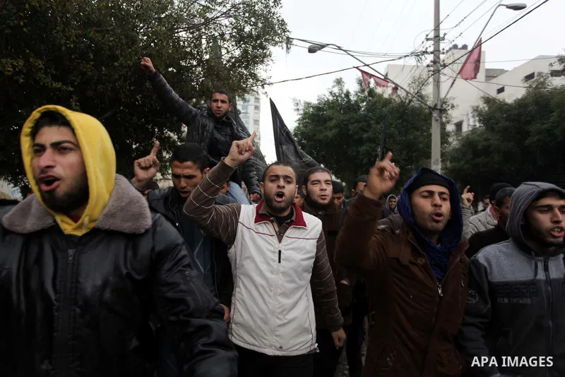 Palestinian supporters of the Islamic Jihad chant slogans against resuming peace talks with Israel as they demonstrate in Gaza City, Jan. 10, 2014. In recent weeks, U.S. Secretary of State John Kerry has stepped up invol...