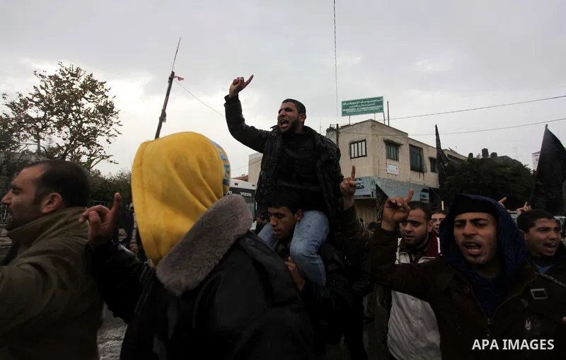 Palestinian supporters of the Islamic Jihad chant slogans against resuming peace talks with Israel as they demonstrate in Gaza City, Jan. 10, 2014. In recent weeks, U.S. Secretary of State John Kerry has stepped up invol...