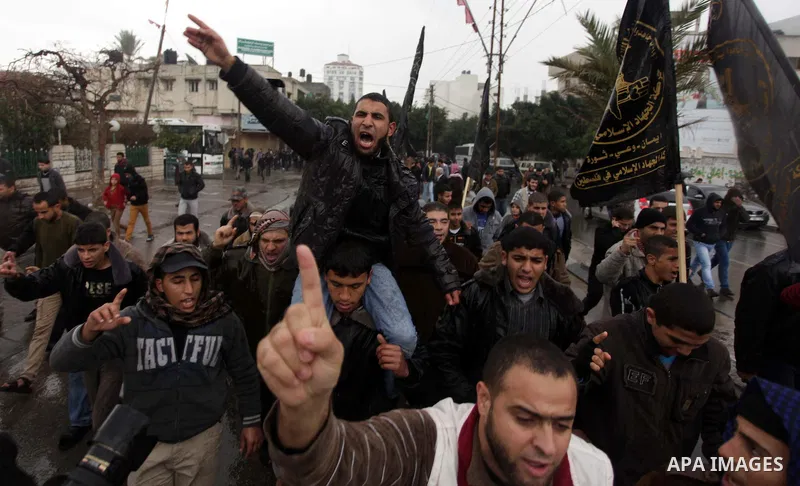 Palestinian supporters of the Islamic Jihad chant slogans against resuming peace talks with Israel as they demonstrate in Gaza City, Jan. 10, 2014. In recent weeks, U.S. Secretary of State John Kerry has stepped up invol...