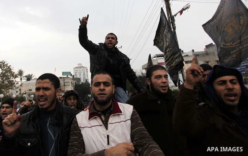 Palestinian supporters of the Islamic Jihad chant slogans against resuming peace talks with Israel as they demonstrate in Gaza City, Jan. 10, 2014. In recent weeks, U.S. Secretary of State John Kerry has stepped up invol...