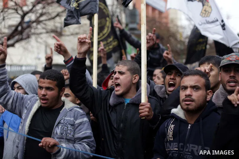 Palestinian supporters of the Islamic Jihad chant slogans against resuming peace talks with Israel as they demonstrate in Gaza City, Jan. 10, 2014. In recent weeks, U.S. Secretary of State John Kerry has stepped up invol...