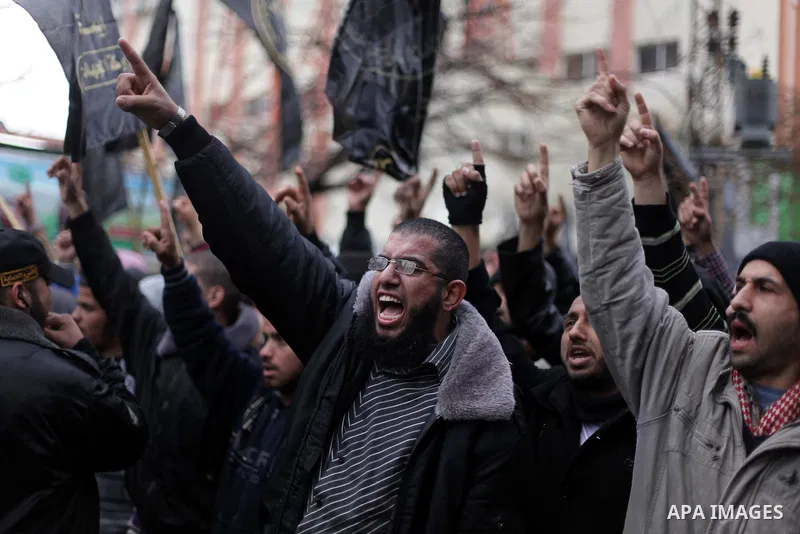Palestinian supporters of the Islamic Jihad chant slogans against resuming peace talks with Israel as they demonstrate in Gaza City, Jan. 10, 2014. In recent weeks, U.S. Secretary of State John Kerry has stepped up invol...