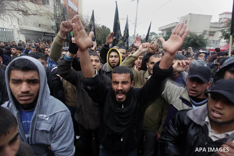Palestinian supporters of the Islamic Jihad chant slogans against resuming peace talks with Israel as they demonstrate in Gaza City, Jan. 10, 2014. In recent weeks, U.S. Secretary of State John Kerry has stepped up invol...