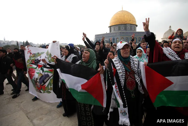 Palestinian worshipers hold placards and chant slogans during a protest calling for the end of the political division between the Gaza Strip Hamas-led leadership and the Palestinian Authority Fatah-led, and in solidarity...
