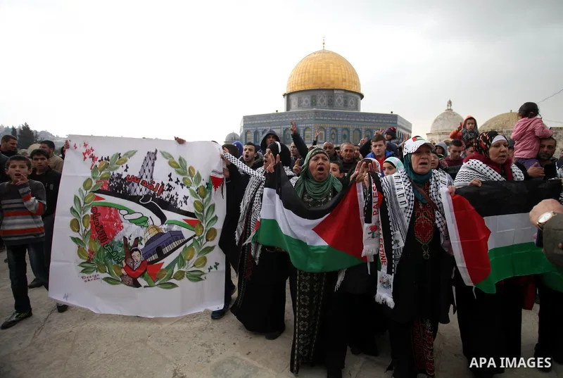Palestinian worshipers hold placards and chant slogans during a protest calling for the end of the political division between the Gaza Strip Hamas-led leadership and the Palestinian Authority Fatah-led, and in solidarity...