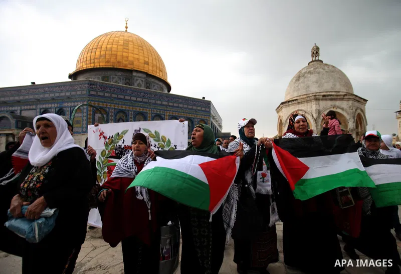 Palestinian worshipers hold placards and chant slogans during a protest calling for the end of the political division between the Gaza Strip Hamas-led leadership and the Palestinian Authority Fatah-led, and in solidarity...