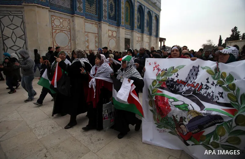 Palestinian worshipers hold placards and chant slogans during a protest calling for the end of the political division between the Gaza Strip Hamas-led leadership and the Palestinian Authority Fatah-led, and in solidarity...