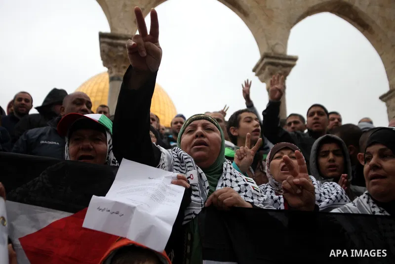 Palestinian worshipers hold placards and chant slogans during a protest calling for the end of the political division between the Gaza Strip Hamas-led leadership and the Palestinian Authority Fatah-led, and in solidarity...