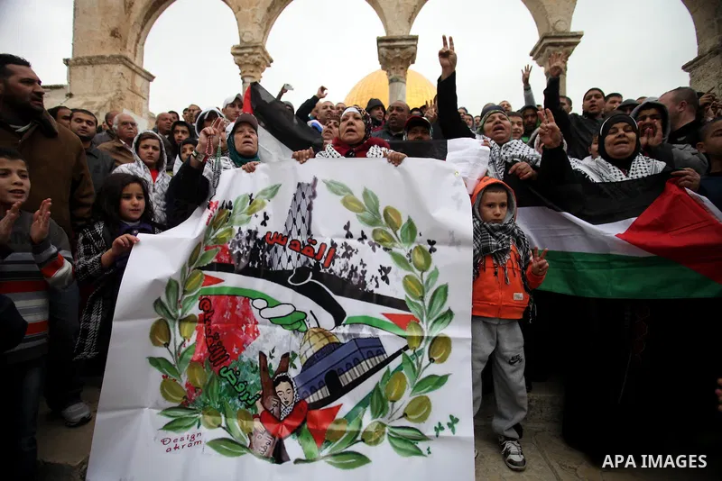 Palestinian worshipers hold placards and chant slogans during a protest calling for the end of the political division between the Gaza Strip Hamas-led leadership and the Palestinian Authority Fatah-led, and in solidarity...