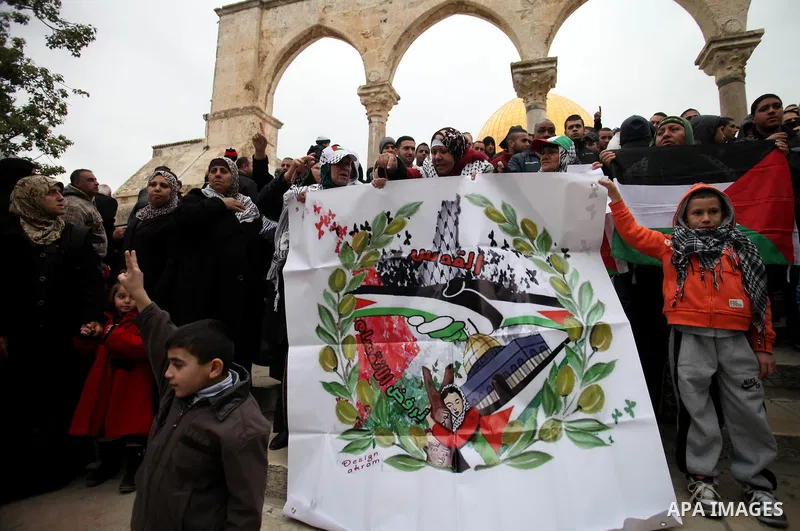 Palestinian worshipers hold placards and chant slogans during a protest calling for the end of the political division between the Gaza Strip Hamas-led leadership and the Palestinian Authority Fatah-led, and in solidarity...