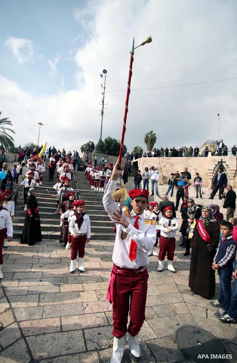 Palestinians attend a celebration commemorate the birth of Islam's Prophet Mohammed in a "Mouled" procession, in front of the Dome of the Rock mosque at the Al-Aqsa compound, Islam's third holiest site, in the old city o...