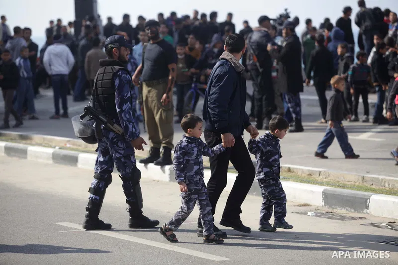 Palestinian security forces show their skills during a military parade in Gaza city on January 13, 2014, marking the fifth anniversary of the three-week Israeli offensive on the Gaza Strip in which more than a thousand P...