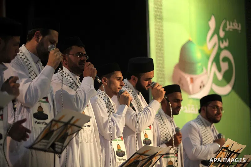 Members of a Palestinian Sufi Muslim group perform during a ritual to commemorate the birth of Islam's Prophet Mohammad, in Gaza City on January 13, 2014. Muslims across the world are celebrating the birth of Islam's pro...