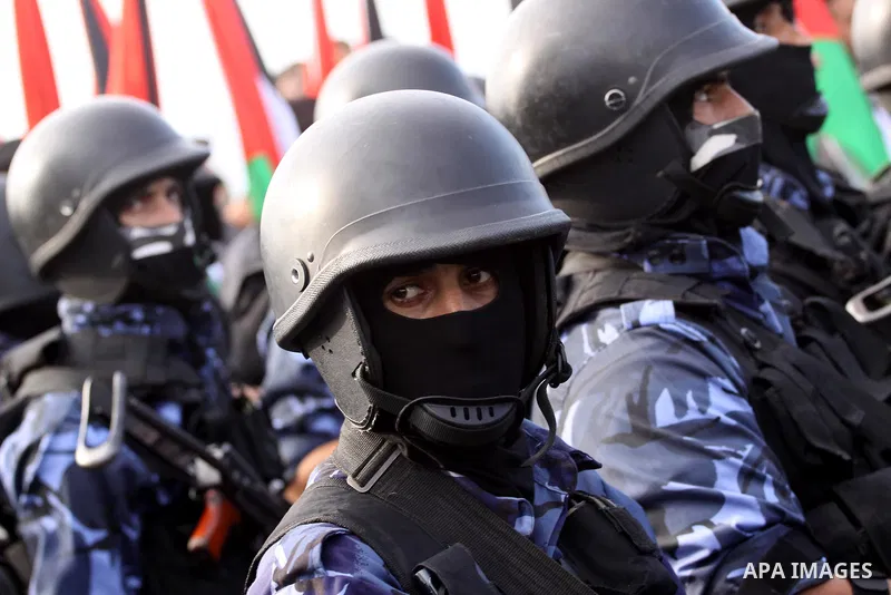 Palestinian security forces show their skills during a military parade in Gaza city on January 13, 2014, marking the fifth anniversary of the three-week Israeli offensive on the Gaza Strip in which more than a thousand P...