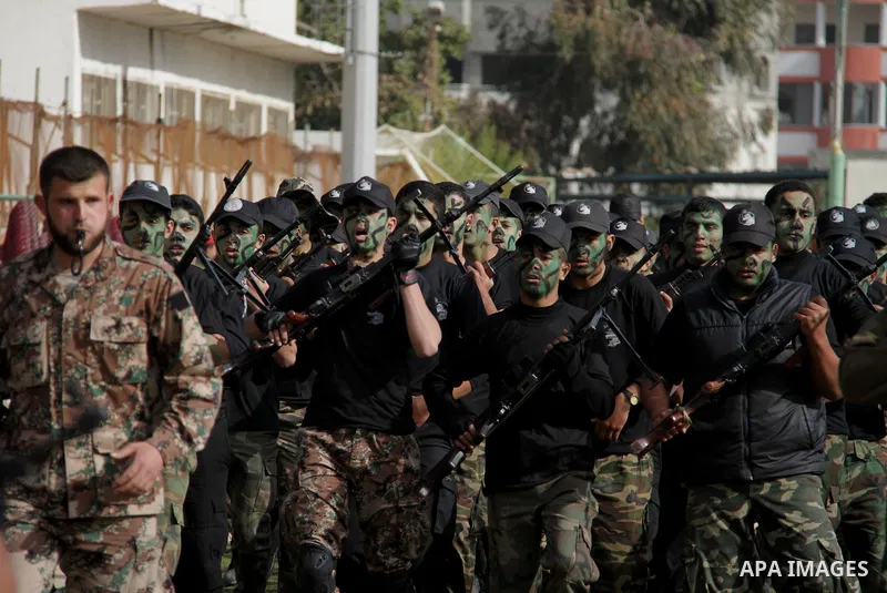 Palestinian high school students take part in a graduation ceremony in Gaza city January 14, 2014. Photo by Ashraf Amra