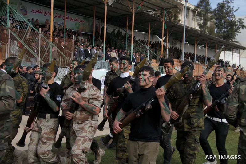 Palestinian high school students take part in a graduation ceremony in Gaza city January 14, 2014. Photo by Ashraf Amra