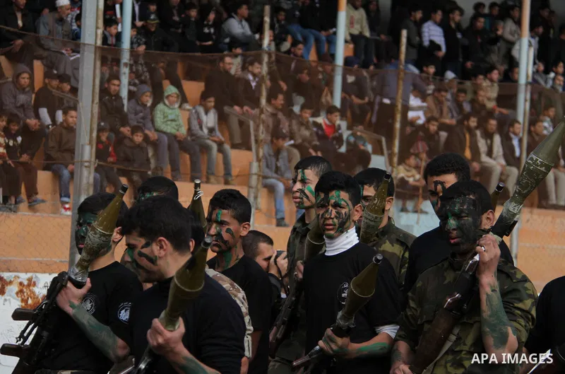 Palestinian high school students take part in a graduation ceremony in Gaza city January 14, 2014. Photo by Ashraf Amra