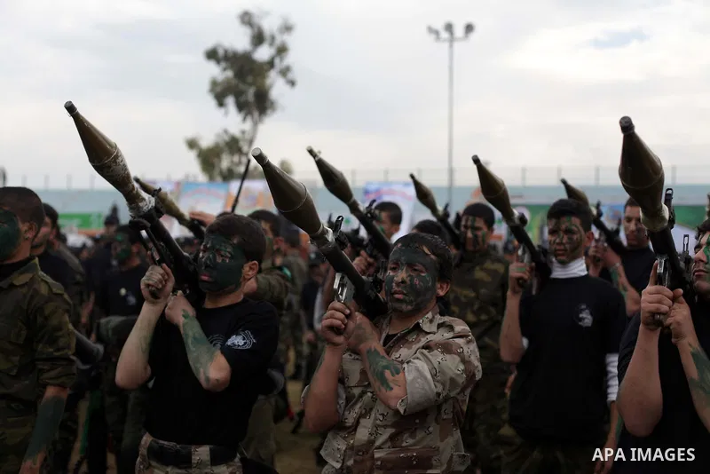 Palestinian students take part in a graduation ceremony for a military-style training programme in Gaza City on January 14, 2014. Some 13,000 students joined the course, which is aimed at preparing them for "liberating P...