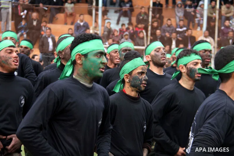 Palestinian students take part in a graduation ceremony for a military-style training programme in Gaza City on January 14, 2014. Some 13,000 students joined the course, which is aimed at preparing them for "liberating P...