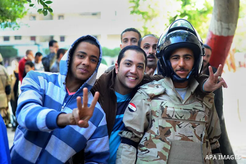 Egyptians cast their votes during the second day of voting on a new constitution on January 15, 2014 in Cairo. Egyptians resumed voting in the constitutional referendum, with turnout expected to hold the key to a likely...