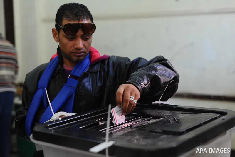 Egyptians cast their votes during the second day of voting on a new constitution on January 15, 2014 in Cairo. Egyptians resumed voting in the constitutional referendum, with turnout expected to hold the key to a likely...