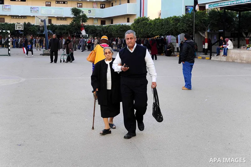 Egyptians cast their votes during the second day of voting on a new constitution on January 15, 2014 in Cairo. Egyptians resumed voting in the constitutional referendum, with turnout expected to hold the key to a likely...