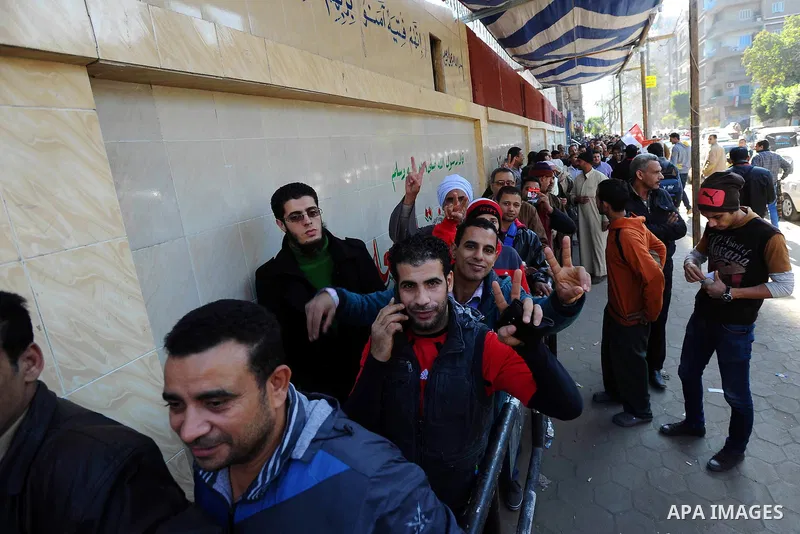 Egyptians cast their votes during the second day of voting on a new constitution on January 15, 2014 in Cairo. Egyptians resumed voting in the constitutional referendum, with turnout expected to hold the key to a likely...