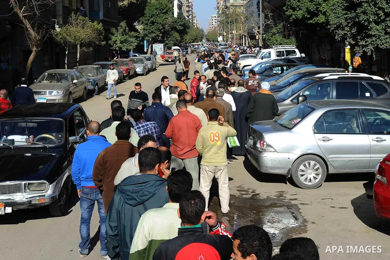 Egyptians cast their votes during the second day of voting on a new constitution on January 15, 2014 in Cairo. Egyptians resumed voting in the constitutional referendum, with turnout expected to hold the key to a likely...