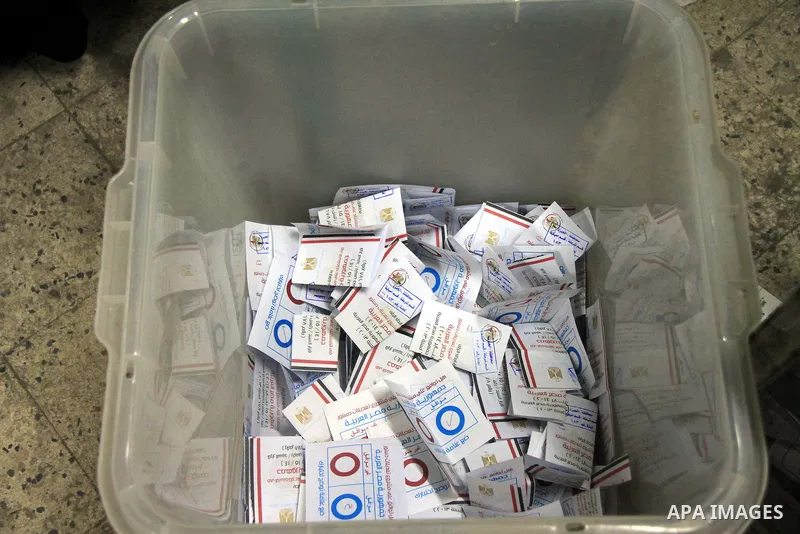 Ballots are seen at a polling station in the Egyptian capital Cairo on January 15, 2014 during the ballot counting at the end of the second day of voting in a referendum on a new constitution. Voting proceeded smoothly i...