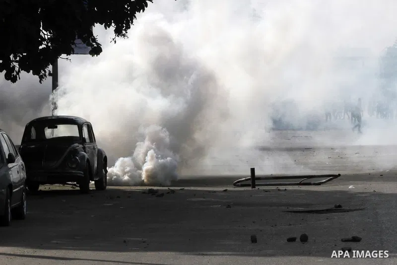 Supporters of Egypt's ousted President Mohammed Morsi clash with security forces near Cairo University in Giza, Egypt, Thursday, Jan. 16, 2014. Egypt's Muslim Brotherhood group and other Islamist groups boycotted the ref...