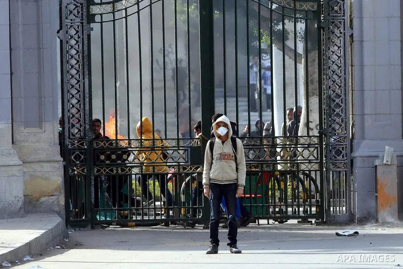 Supporters of Egypt's ousted President Mohammed Morsi clash with security forces near Cairo University in Giza, Egypt, Thursday, Jan. 16, 2014. Egypt's Muslim Brotherhood group and other Islamist groups boycotted the ref...