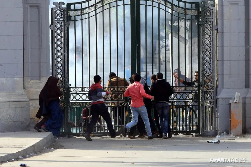 Supporters of Egypt's ousted President Mohammed Morsi clash with security forces near Cairo University in Giza, Egypt, Thursday, Jan. 16, 2014. Egypt's Muslim Brotherhood group and other Islamist groups boycotted the ref...