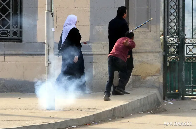 Supporters of Egypt's ousted President Mohammed Morsi clash with security forces near Cairo University in Giza, Egypt, Thursday, Jan. 16, 2014. Egypt's Muslim Brotherhood group and other Islamist groups boycotted the ref...
