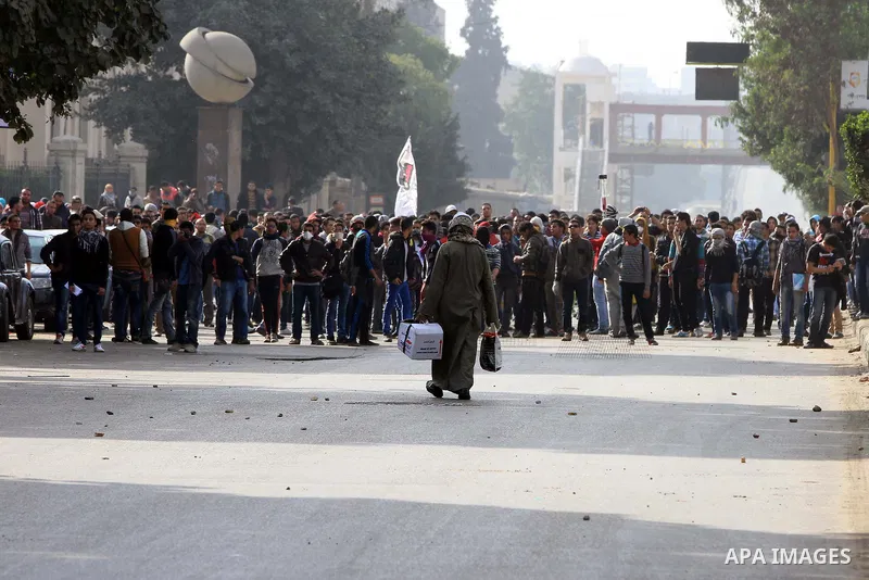 Supporters of Egypt's ousted President Mohammed Morsi clash with security forces near Cairo University in Giza, Egypt, Thursday, Jan. 16, 2014. Egypt's Muslim Brotherhood group and other Islamist groups boycotted the ref...