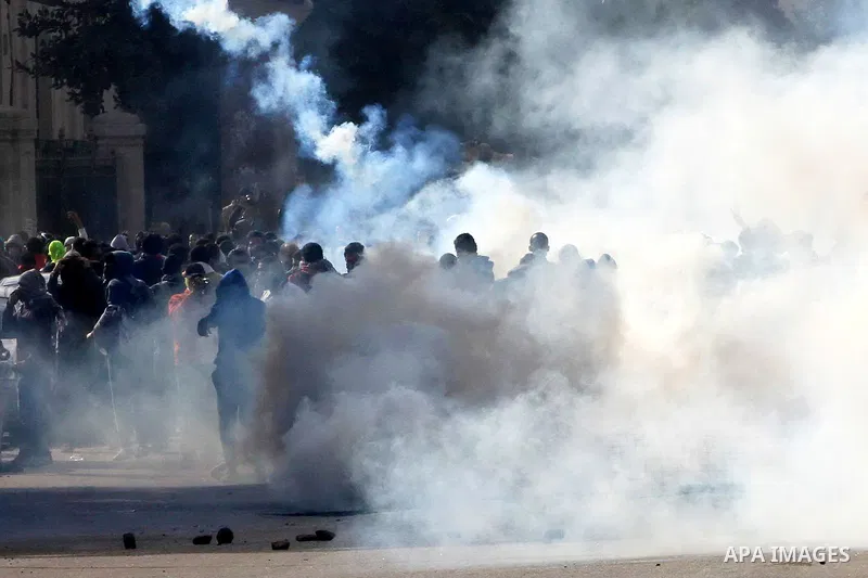 Supporters of Egypt's ousted President Mohammed Morsi clash with security forces near Cairo University in Giza, Egypt, Thursday, Jan. 16, 2014. Egypt's Muslim Brotherhood group and other Islamist groups boycotted the ref...