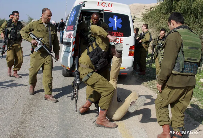 Israeli security forces detain an activist during a protest against the Israel's intention to annex the Jordan Valley, near the West Bank City of Jericho January 18, 2013. Rightwing Israeli government ministers have step...